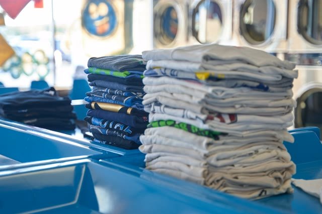 Stacks of folded printed shirts